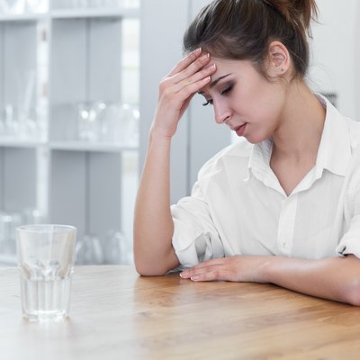 Portrait of woman with headache