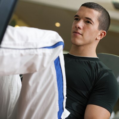 Man in gym on machine exercising