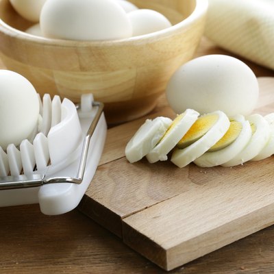sliced boiled egg for salad on the board