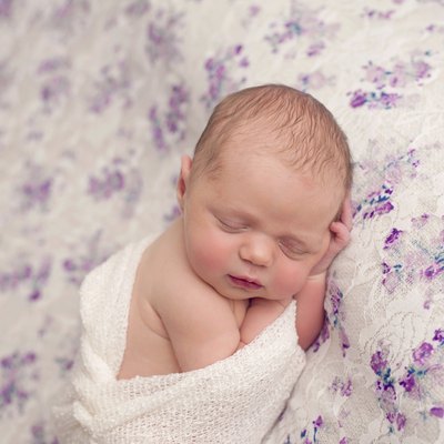 Newborn Girl Sleeping in Swaddle