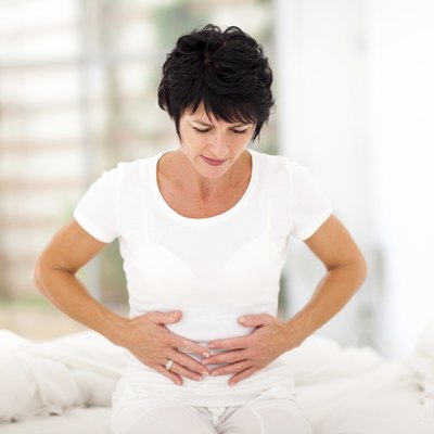 mid age woman having stomach pain