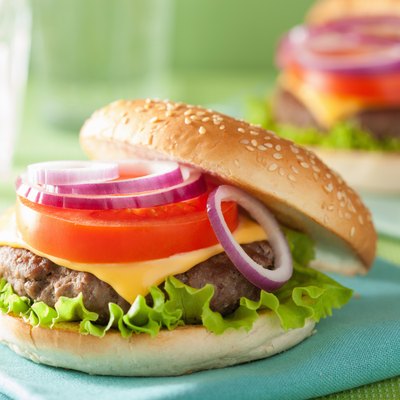 cheese burger with beef patty lettuce onion tomato