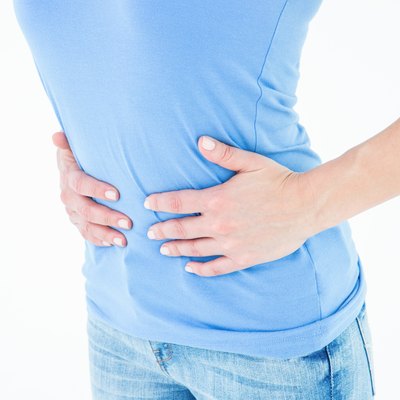 Woman suffering from stomach pain