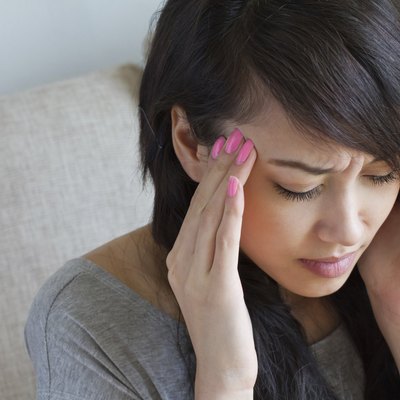 woman with headache, migraine, stress, insomnia, hangover, asian