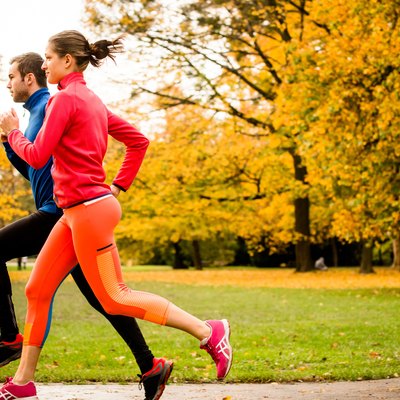 Couple jogging in autumn nature