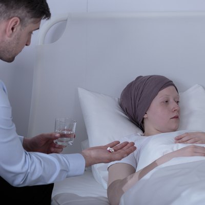 Father giving ill daughter medicines