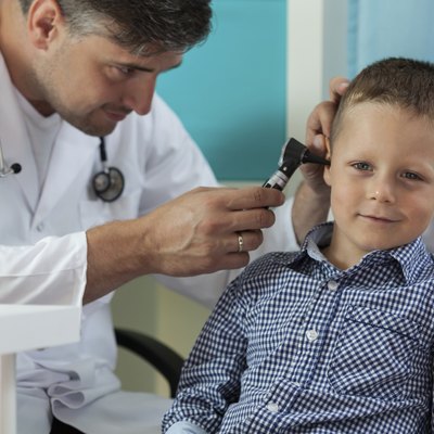 Boy during ear examination