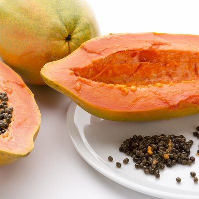 Hollowed Out Papaya Half And Its Peppery Seeds