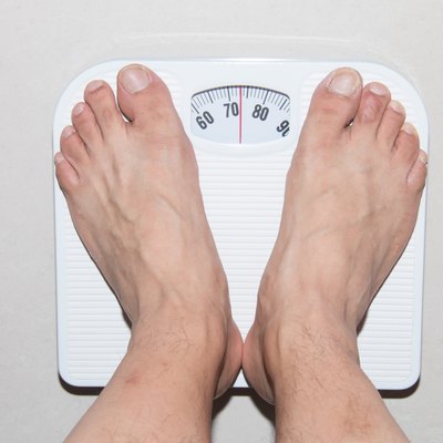 Closeup of a Asians weighed
