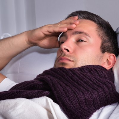 Man Suffering From Cold And Fever