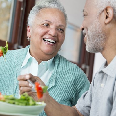 Black couple eating salad