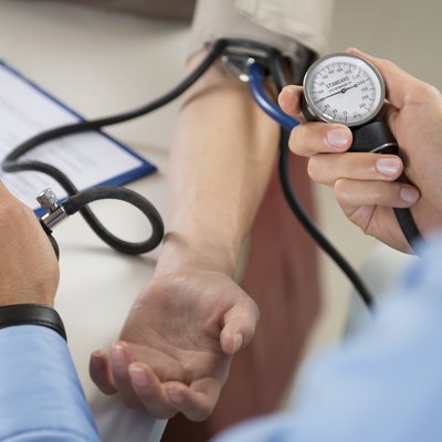 Doctor Measures Pressure In The Patient
