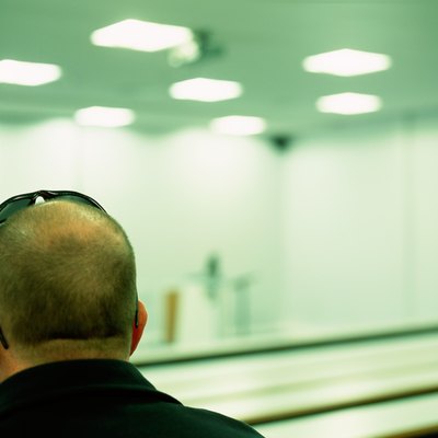 Man sits in empty auditorium
