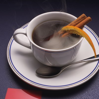 Coffee with Cinnamon Stick and Orange, High Angle View, Full Frame