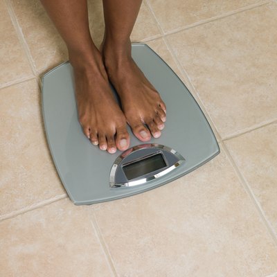 Feet of woman on scales