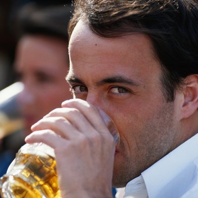 Man drinking beer, close up