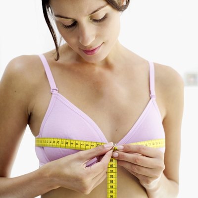 woman measuring her chest