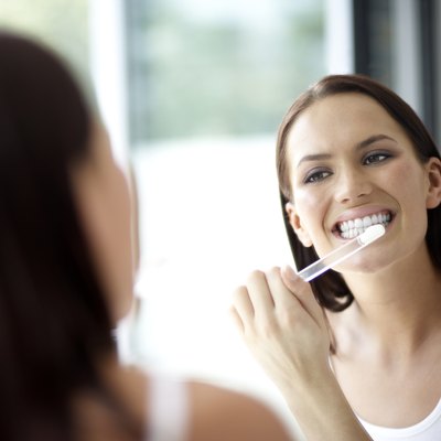 Woman brushing her teeth, close-up