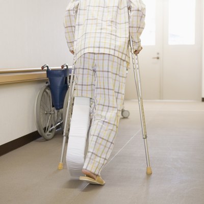 Patient walking with crutches in hospital