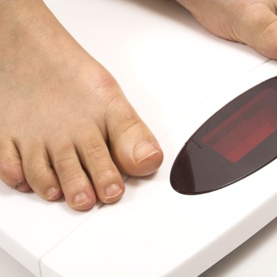 feet on white scale