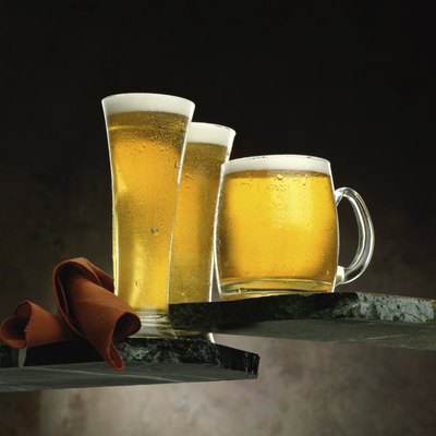 Two glasses and a mug of beer