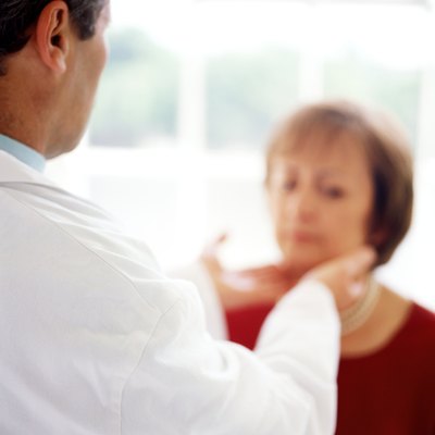 black and white portrait of a doctor checking a patients throat glands