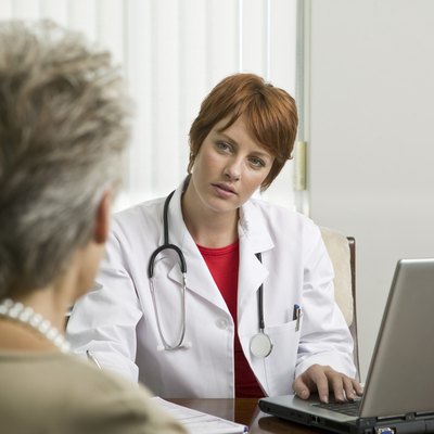 Doctor with patient in office