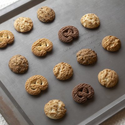 Cookies on baking tray, high angle view