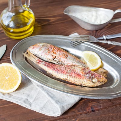 Fried red mullet on the oval dish