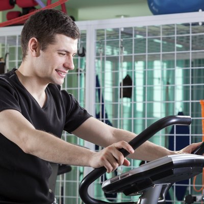 Man cycling on exercise bike