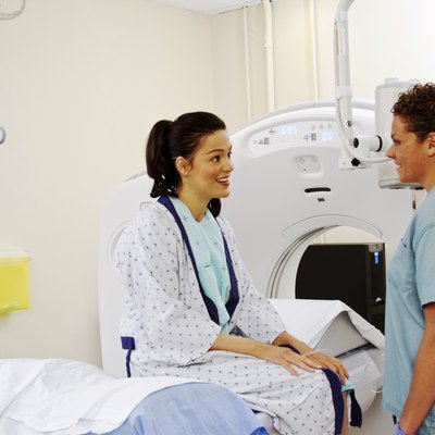 Technician giving patient instructions for ultrasound