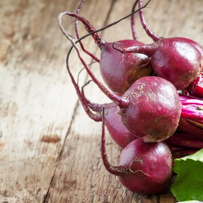Bunch of fresh organic beets with tops