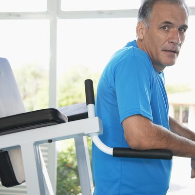 Mature man on exercise machine (portrait)