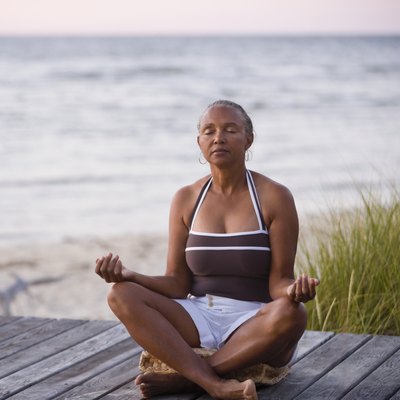 Senior African American woman meditating
