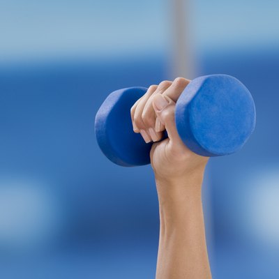 Hand holding free weight