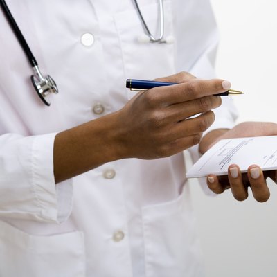 Doctor writing prescription
