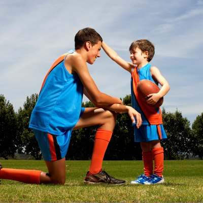 Young boy facing older boy