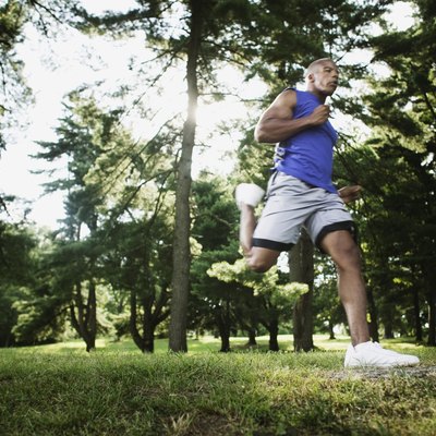Man jogging through woods
