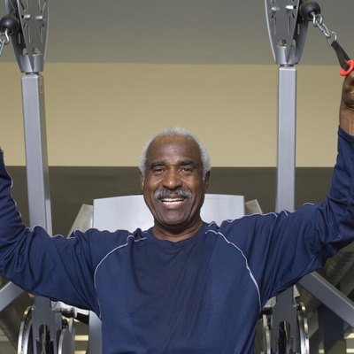 Senior Man Working Out on Weightlifting Machine