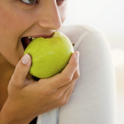 Woman eating apple