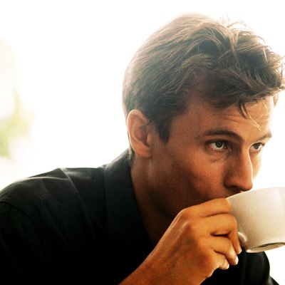 Young man drinking a cup of coffee