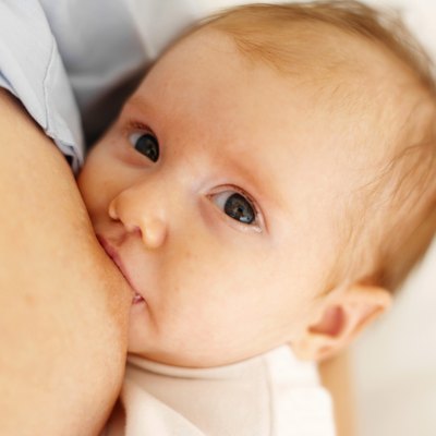 close up view of a baby (6-12 months) breastfeeding