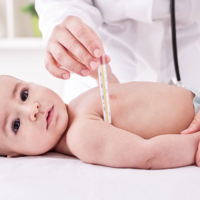 Fever, measuring temperature for little boy