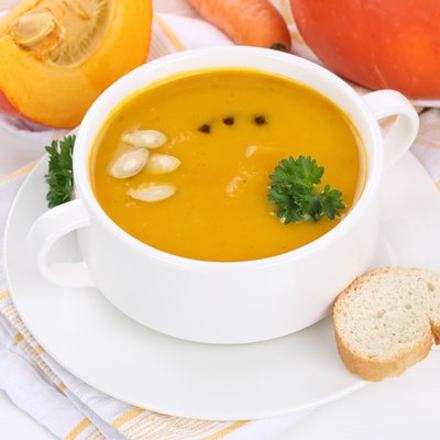 Pumpkin soup with pumpkins in cup
