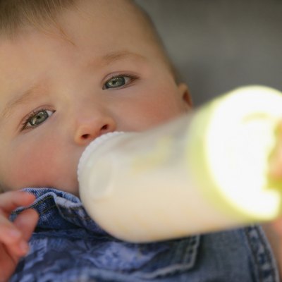 Baby feeding from bottle