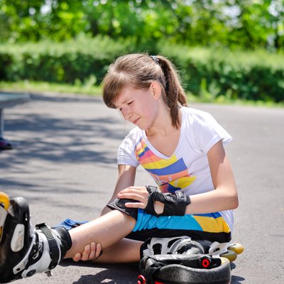 Skater nursing an injured knee
