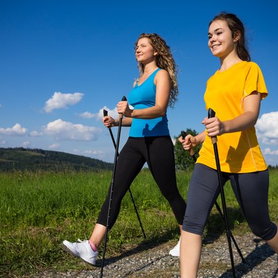 Healthy lifestyle - young women Nordic walking
