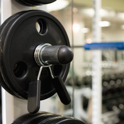 Weights on an exercise machine in gym, close up, differential focus