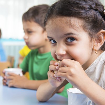 Cute little children drinking milk