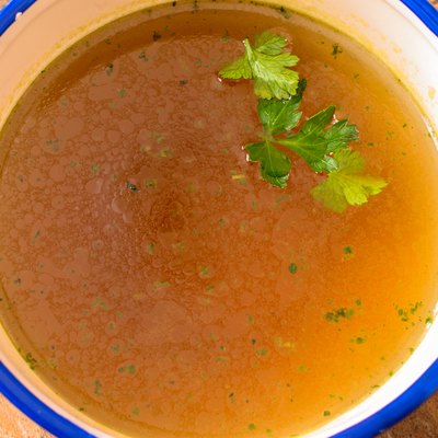 Beef soup with parsley close up